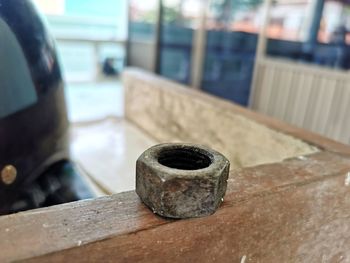 Close-up of rusty metal on table