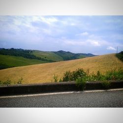 Road passing through field