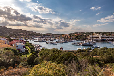 View of town by sea against sky