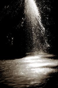 Blurred motion of water splashing in the dark