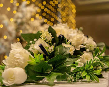 Close-up of white roses on table
