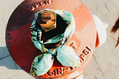 High angle view of fabric tied up on metal