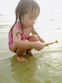 Cute girl playing in water