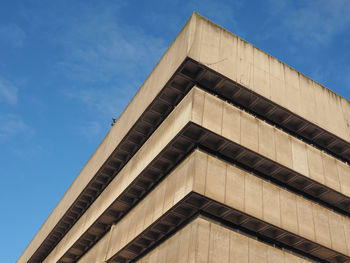 Low angle view of building against cloudy sky