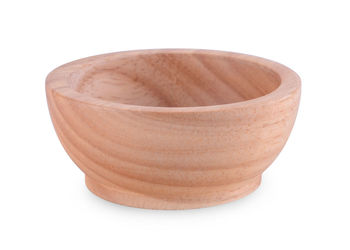 High angle view of bowl on table against white background