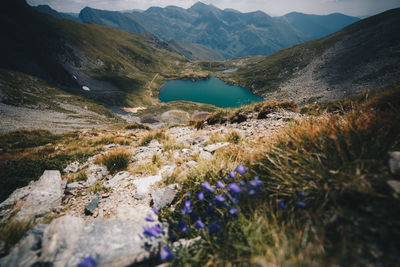 Scenic view of lake and mountains against sky