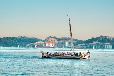 Tourist boat in the tagus river in lisbon portugal