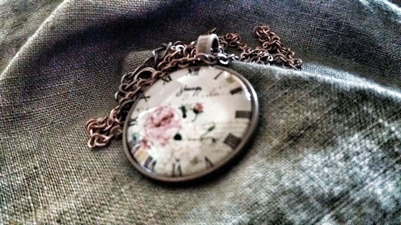 time, close-up, indoors, circle, transportation, bicycle, clock, high angle view, no people, number, part of, mode of transport, old-fashioned, old, day, clock face, selective focus, reflection, directly above, wheel