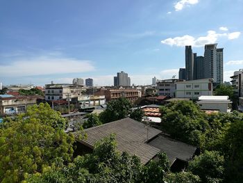 High angle view of trees and buildings against sky