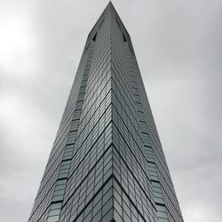 Low angle view of skyscraper against sky