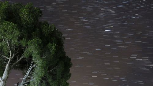 Scenic view of river against sky at night