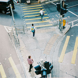 High angle view of people crossing road