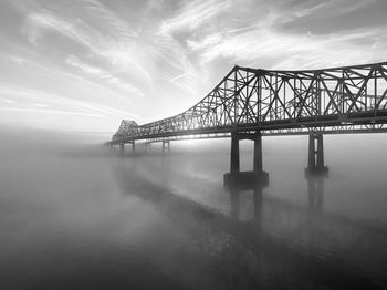 Bridge over sea against sky