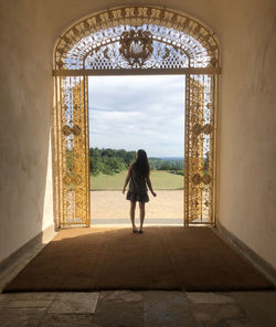 Girl standing in arch