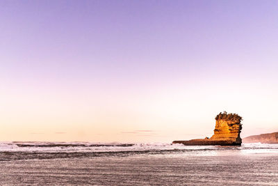 Scenic view of sea against clear sky during sunset