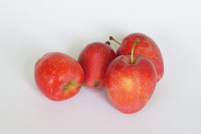 Close-up of apples against white background