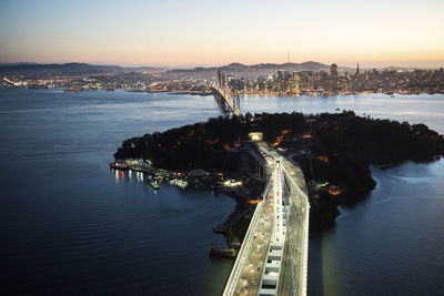 Aerial view of bay bridge and yerba buena island at dusk