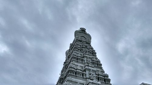 Low angle view of statue against cloudy sky