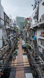 High angle view of railroad tracks amidst buildings in city