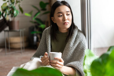 Young woman using mobile phone