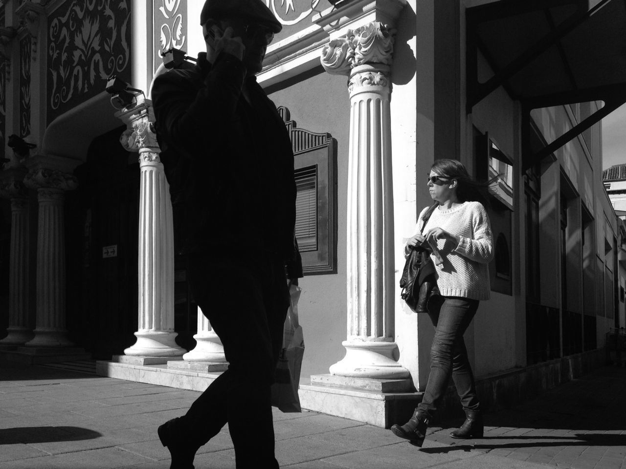 architecture, full length, built structure, building exterior, lifestyles, men, casual clothing, walking, leisure activity, rear view, standing, person, sunlight, building, city, street, shadow