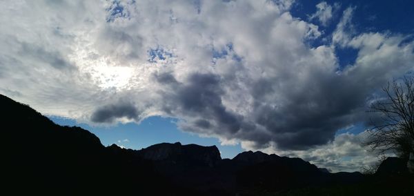 Low angle view of silhouette mountain against sky