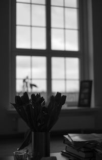 Close-up of flower vase on table at home