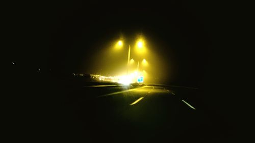 Illuminated street light at night