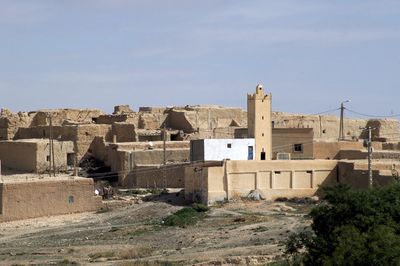 Buildings in city against sky