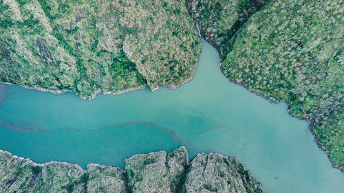 Aerial view of river amidst rock formation