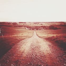 Road passing through field