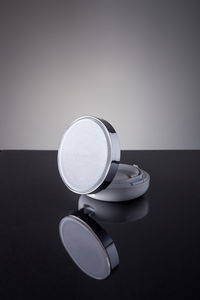 Close-up of powder compact on table