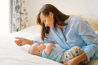 Portrait of a happy mother and child. a young mother is play with little baby boy