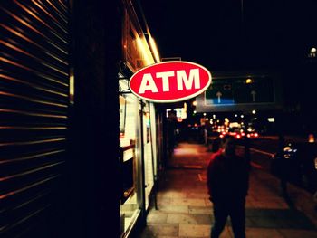 View of information sign at night