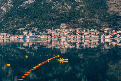 Aerial view of lake and buildings in city