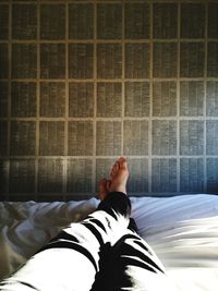 Low section of woman standing on tiled floor