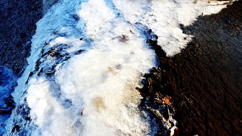 High angle view of rocks in sea