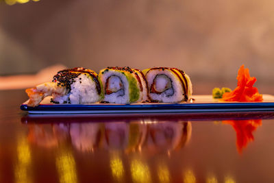 Close-up of sushi served on table