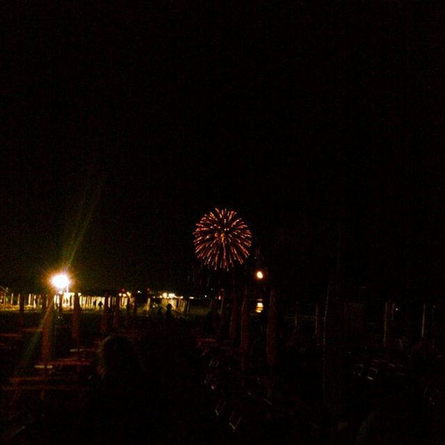 night, illuminated, celebration, firework display, arts culture and entertainment, glowing, exploding, long exposure, firework - man made object, dark, sky, copy space, motion, clear sky, event, lighting equipment, sparks, outdoors, light - natural phenomenon, no people