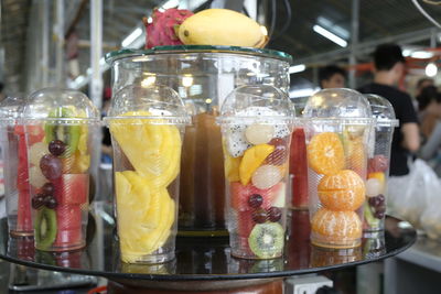 Close-up of fruits in glass for sale