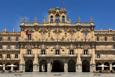 Low angle view of building against blue sky