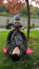 Full length of man lying down on field