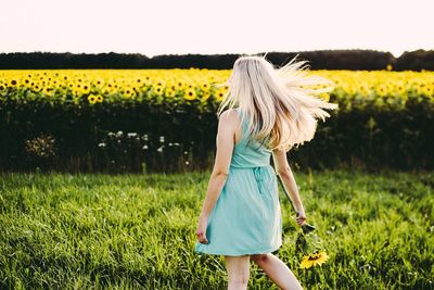 Full length of woman standing on field