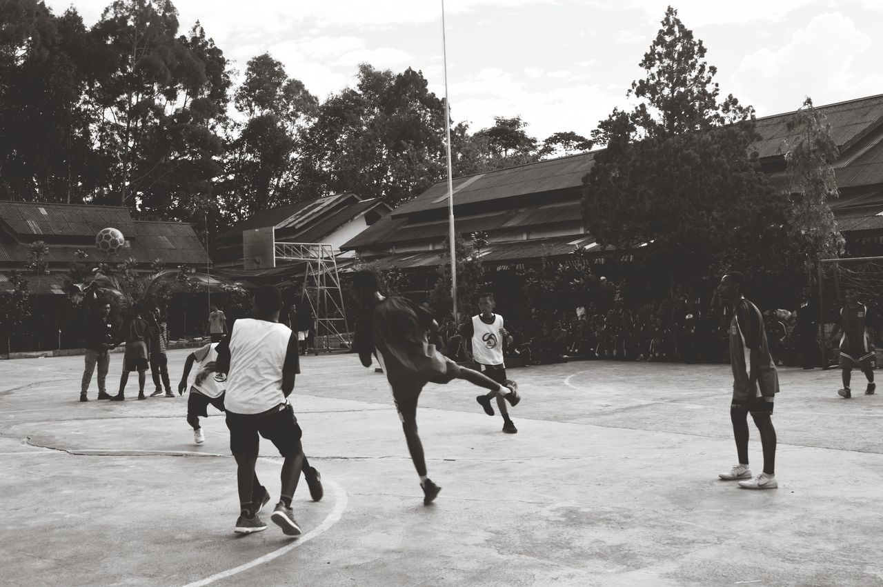 GROUP OF PEOPLE PLAYING SOCCER