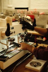 Man make coffee on coffe machine