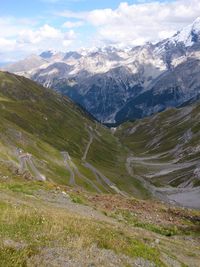 Scenic view of mountains against cloudy sky