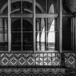 Seat by window of building