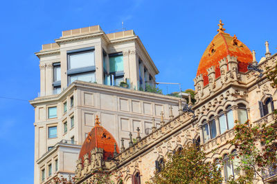 Low angle view of building against blue sky