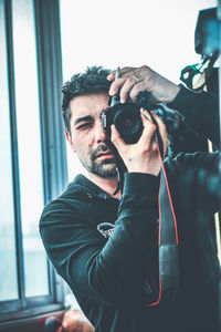 Portrait of man photographing