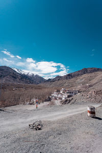 Scenic view of landscape against blue sky